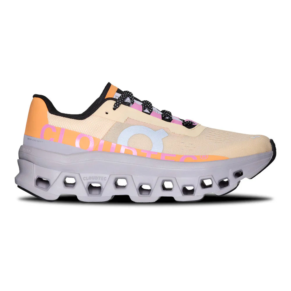 Side view on white background of Womens On Cloudmonster running shoe in Blonde/Fade, Medium (Regular) width