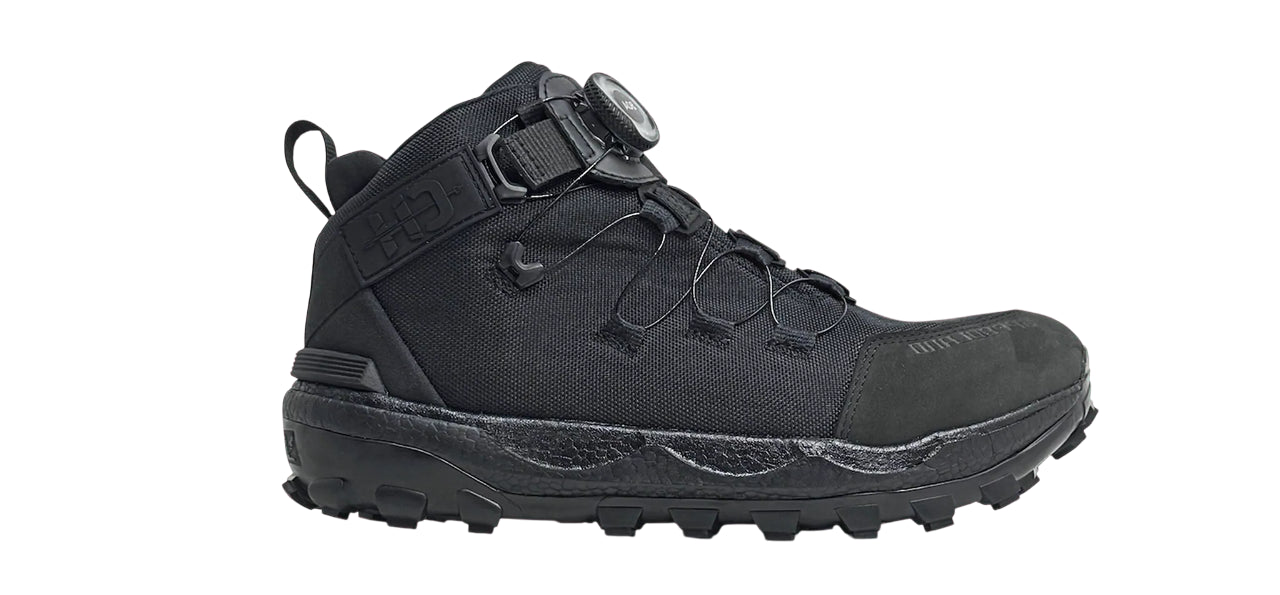 Side view on white background of Unisex Speedland XB:BLK running shoe in Black/Black, Medium (Regular) width