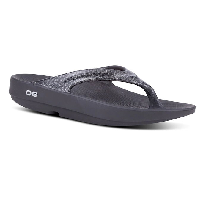 Side view on white background of Womens OOFOS OOahh Luxe Sandal running shoe in Platinum Sparkle, Medium (Regular) width