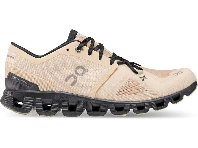 Side view on white background of Womens On Cloud X 3 running shoe in Fawn/Magnet, Medium (Regular) width
