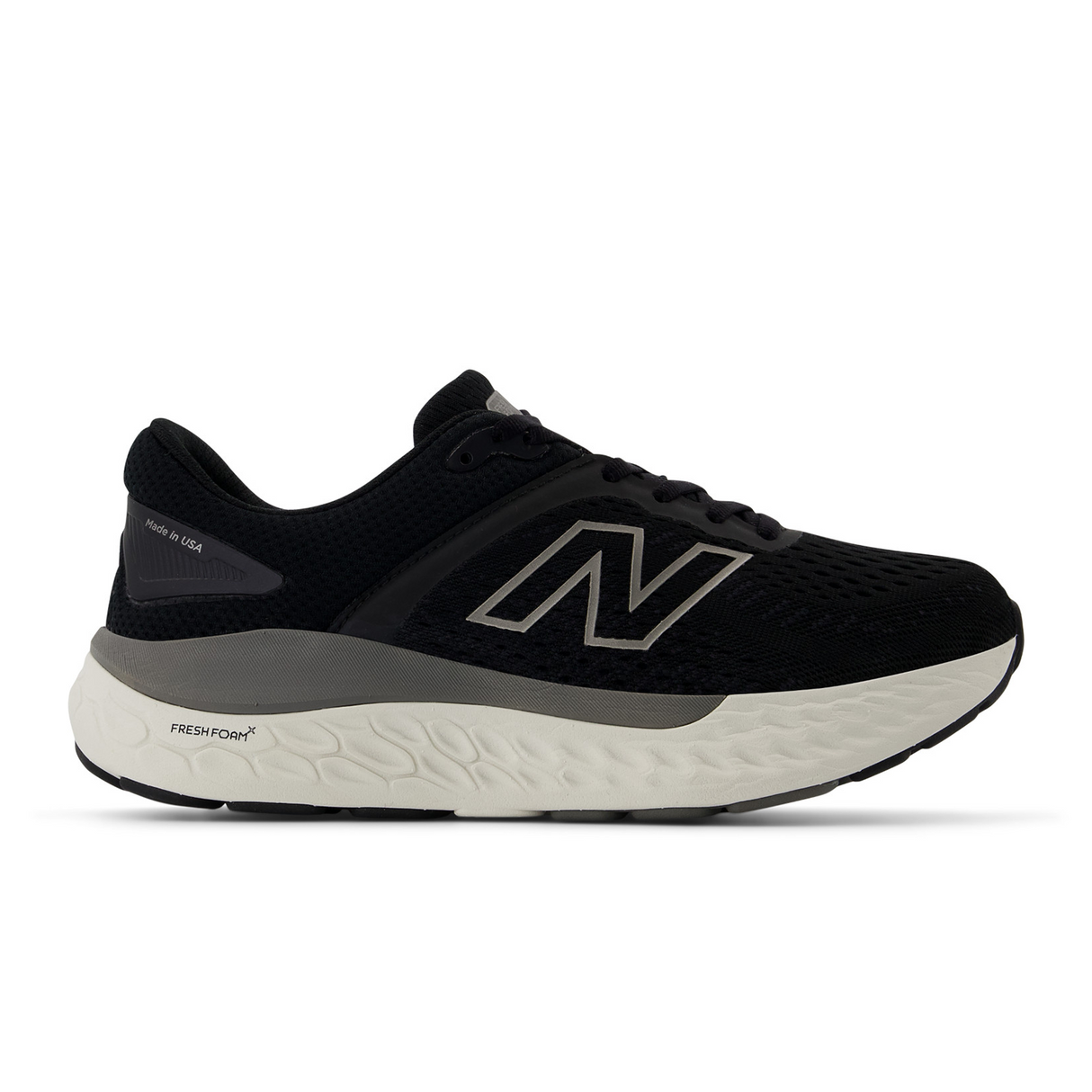 Side view on white background of Womens New Balance Fresh Foam X 1540v4 running shoe in Black/Grey, Wide width