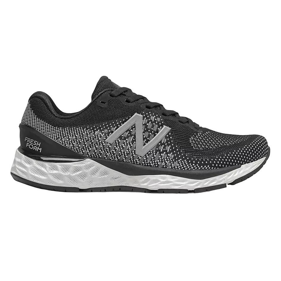 Side view on white background of Youth New Balance Fresh Foam 880 v10 running shoe in Black/Summer Fog/White, Medium (Regular) width