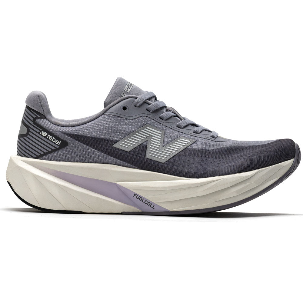 Side view on white background of Womens New Balance FuelCell Rebel running shoe in Digital Mist/Magnet, Medium (Regular) width