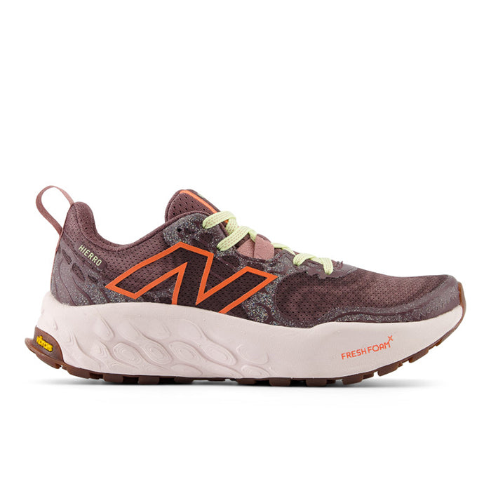 Side view on white background of Womens New Balance Fresh Foam X Hierro V8 running shoe in Licorice/Gulf Red/Pink Granite, Medium (Regular) width