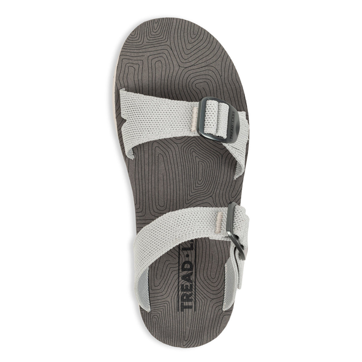 Overhead flat lay of Tread Labs Salinas Slide women's sandal in Mirage grey showing adjustable strap buckles and arch support insole