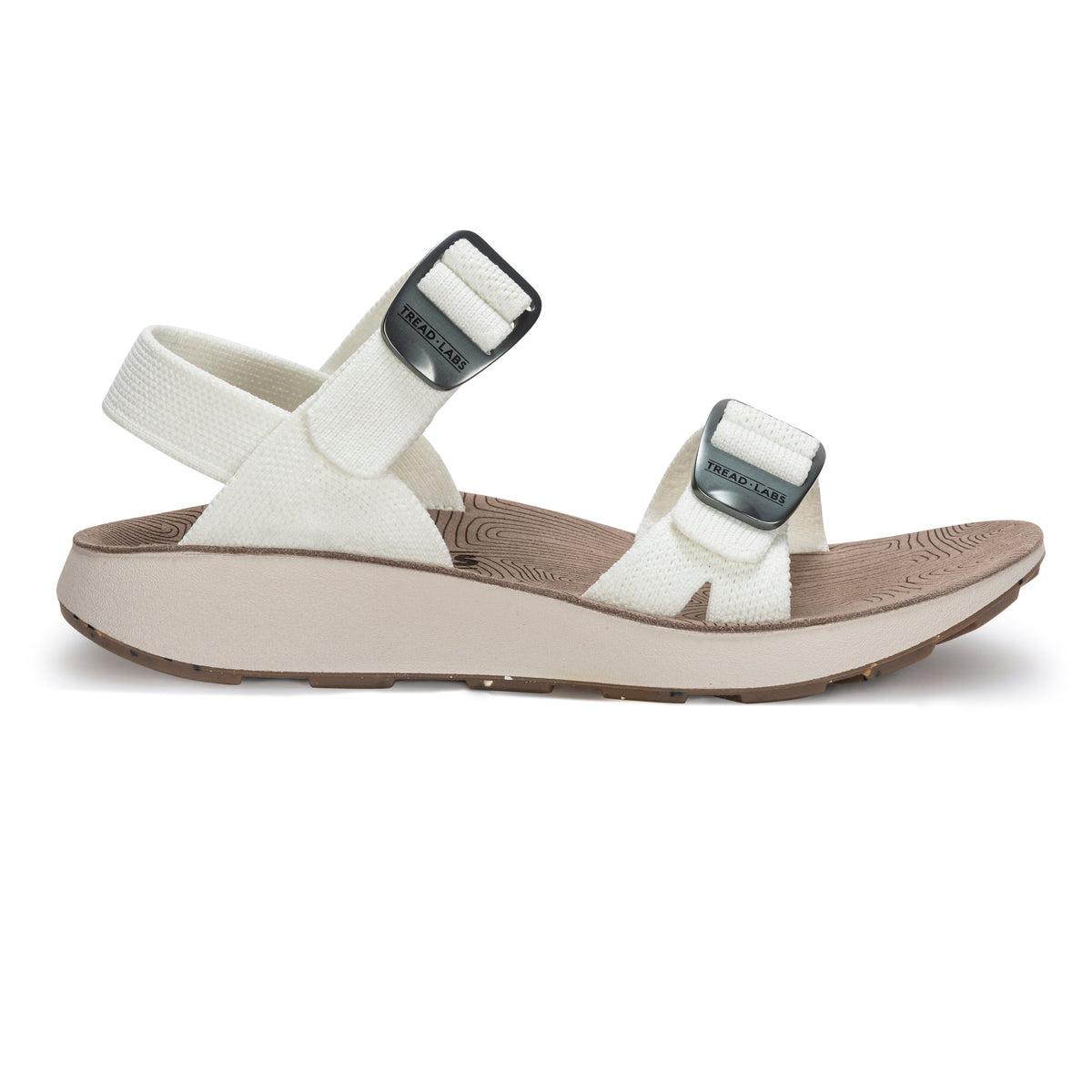 Tread Labs Salinas Slide women's sandal in Coconut white - side profile view showing adjustable buckle straps and cushioned arch support footbed