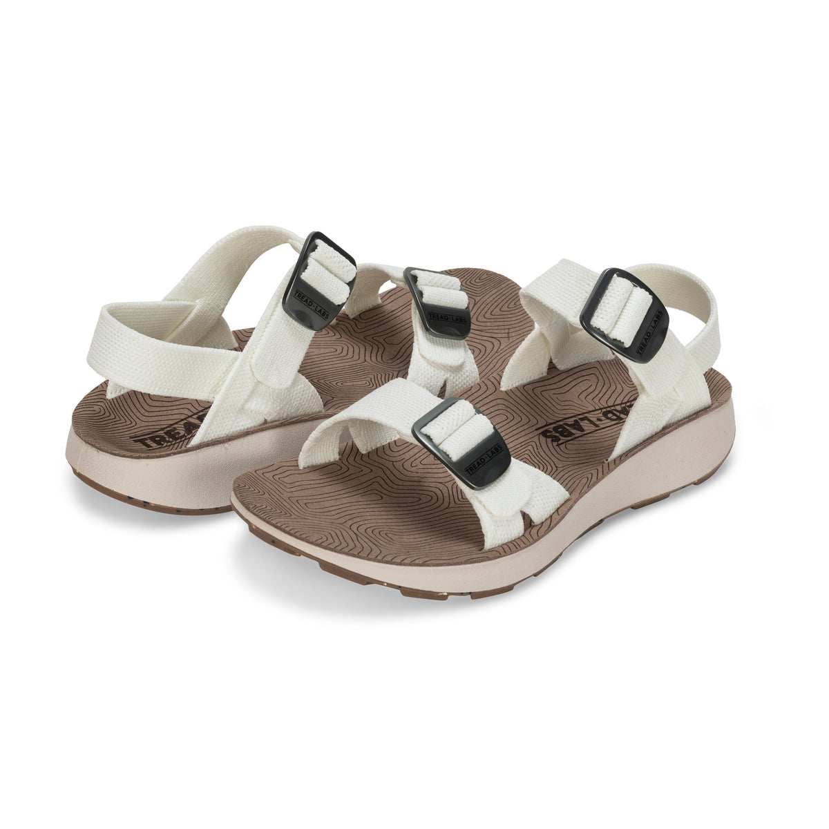 Pair of Tread Labs Salinas Slide women's arch support sandals in Coconut white, angled view showing double-buckle adjustable straps