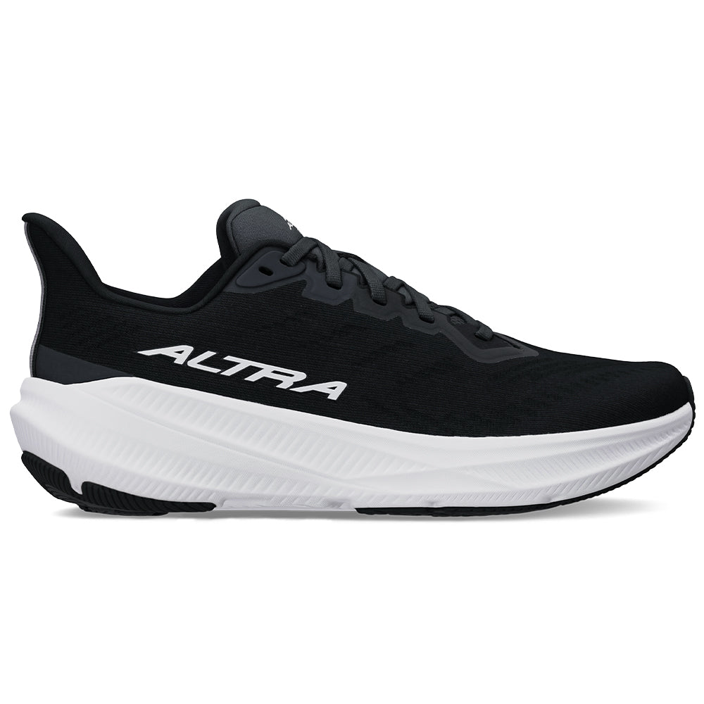 Side view on white background of Womens Altra Experience running shoe in Black/White, Medium (Regular) width
