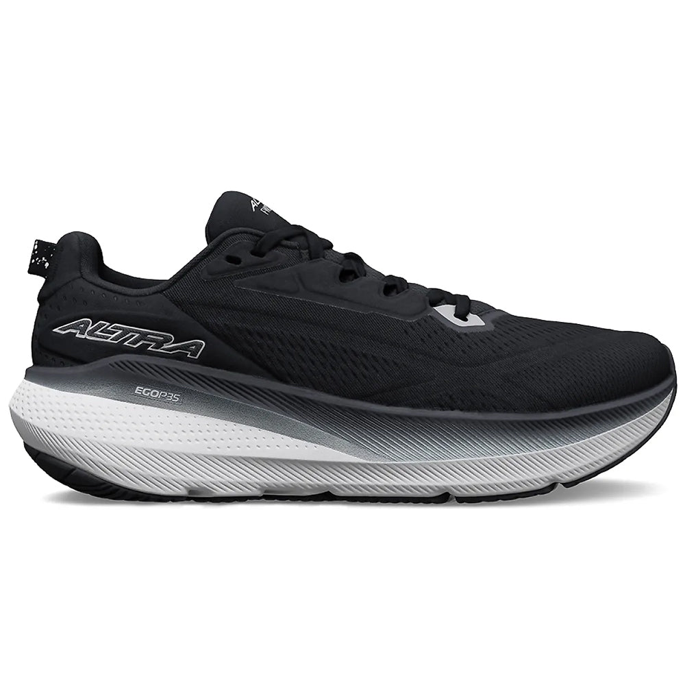 Side view on white background of Womens Altra FWD Via running shoe in Black/White, Medium (Regular) width