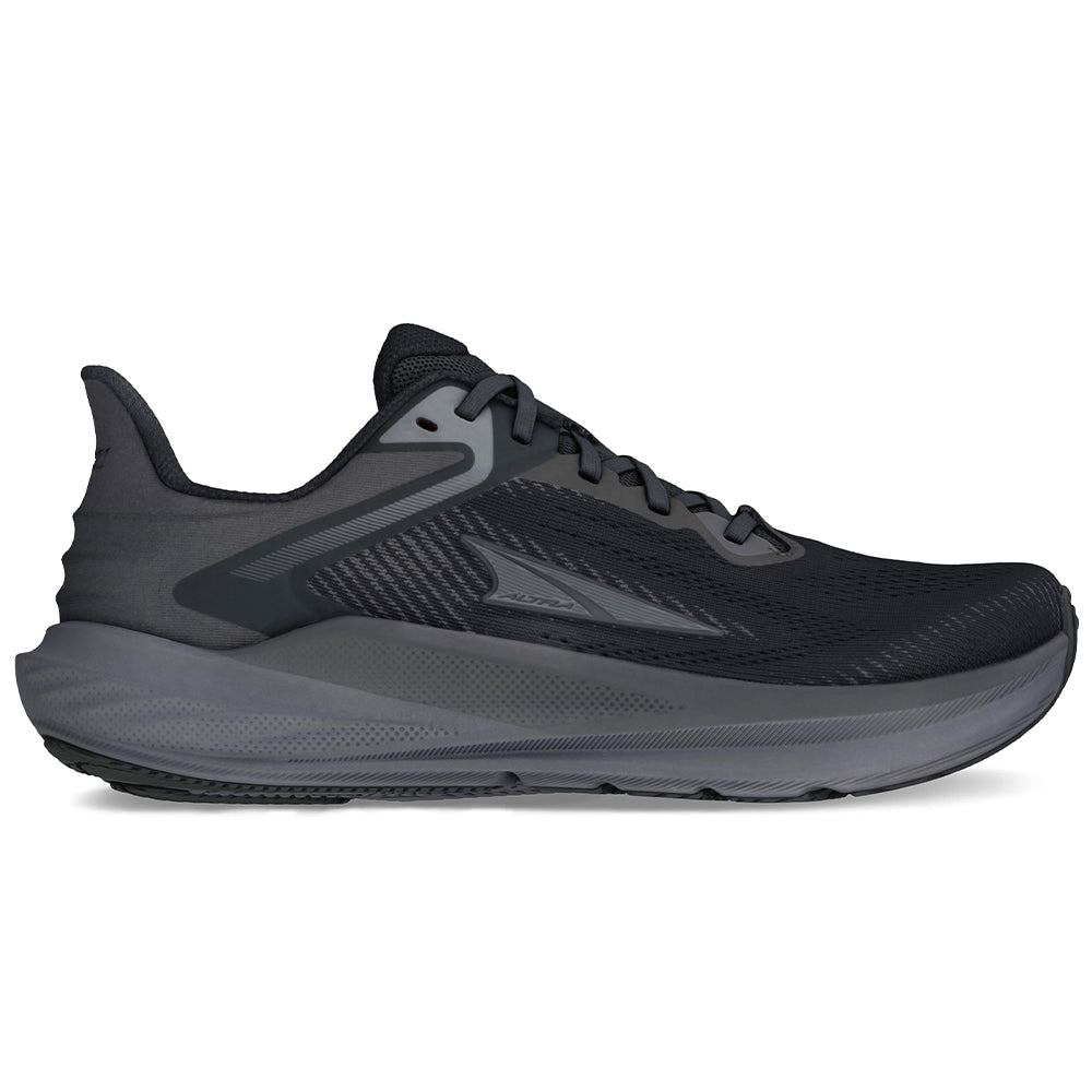 Side view on white background of Womens Altra Torin running shoe in Black, Medium (Regular) width