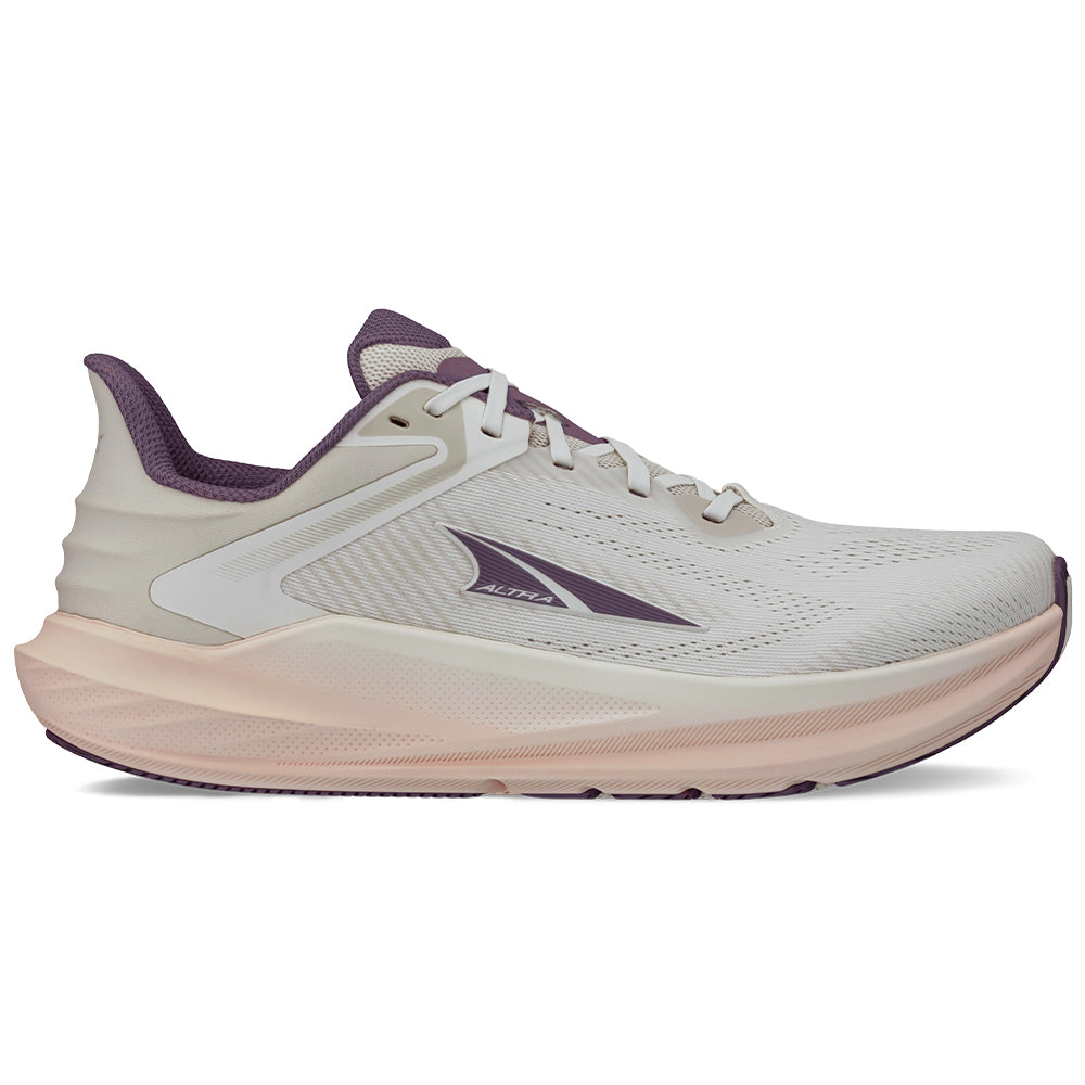 Side view on white background of Womens Altra Torin running shoe in Tan, Medium (Regular) width