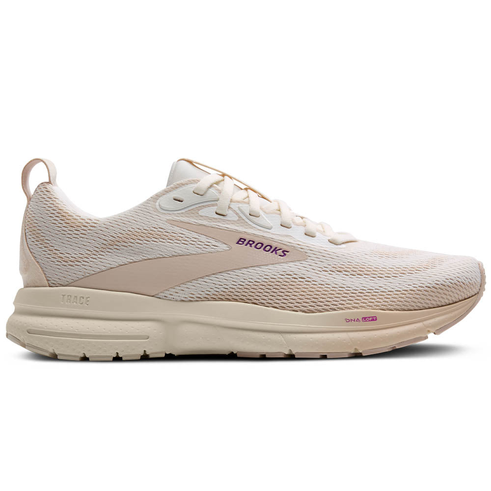 Side view on white background of Womens Brooks Trace running shoe in Coconut Milk/Almond/Purple, Medium (Regular) width