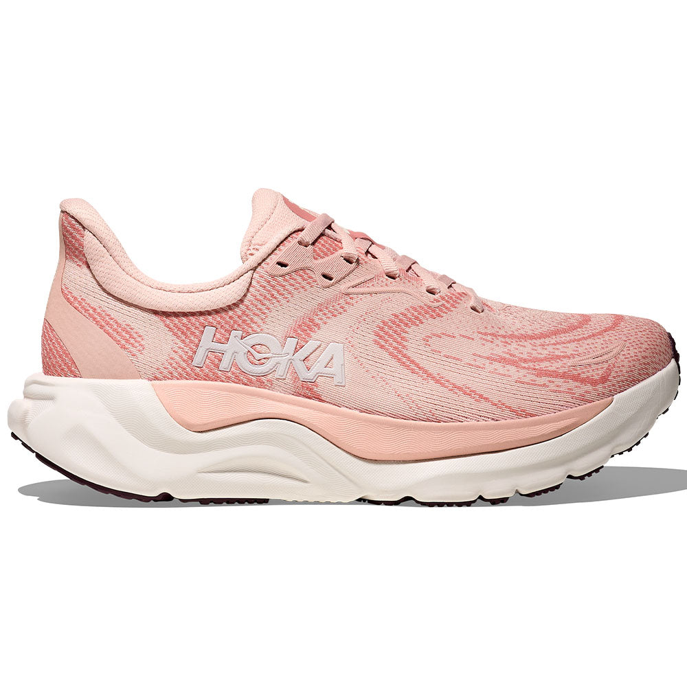 Side view on white background of Womens Hoka Arahi running shoe in Blush/Rose Latte, Medium (Regular) width