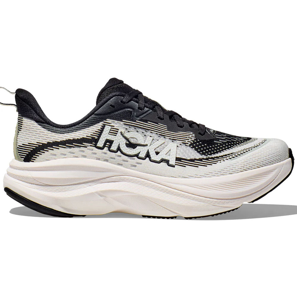 Side view on white background of Womens Hoka Skyflow running shoe in Black/White, Wide width