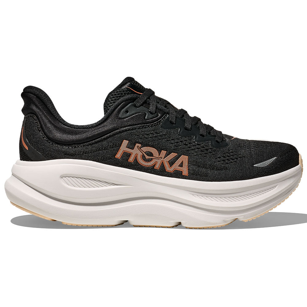 Side view on white background of Womens Hoka Bondi running shoe in Black/Rose Gold, Medium (Regular) width