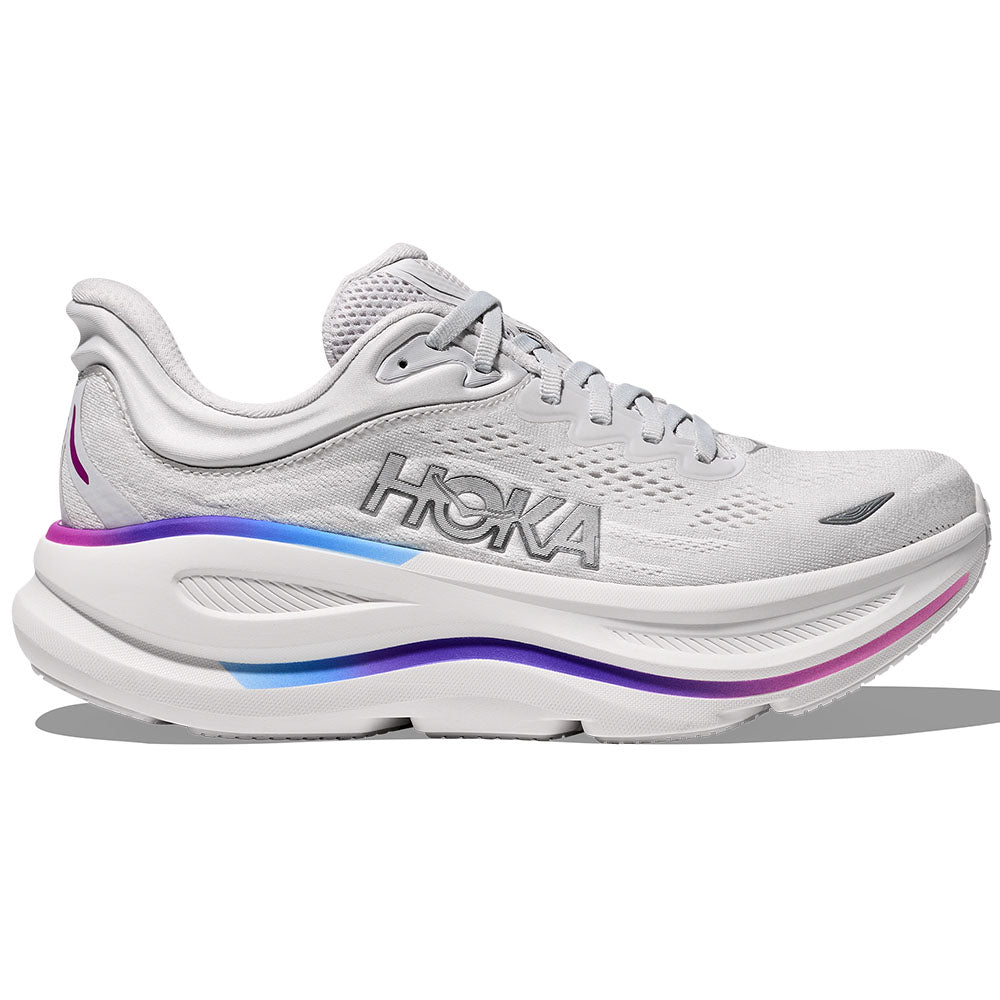 Side view on white background of Womens Hoka Bondi running shoe in Cosmic Grey/White, Wide width