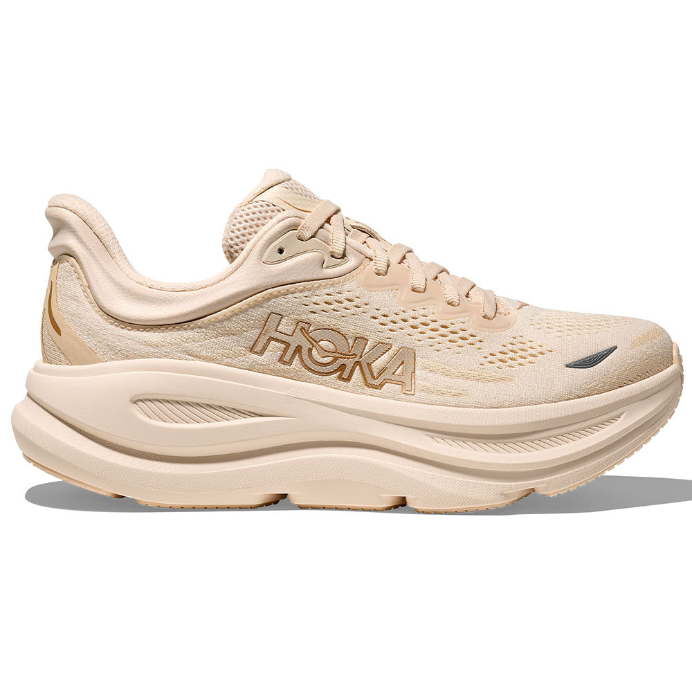 Side view on white background of Womens Hoka Bondi running shoe in Vanilla/Birch, Medium (Regular) width