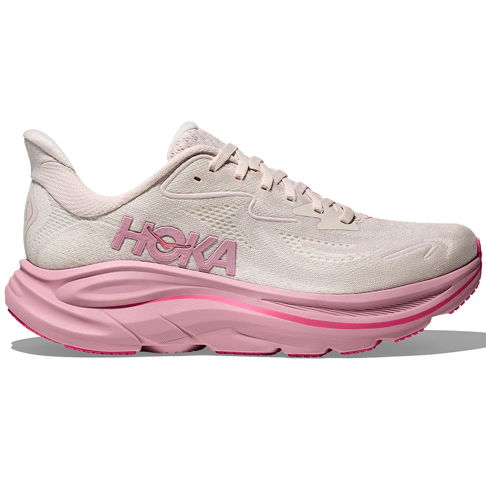 Side view on white background of Womens Hoka Clifton running shoe in Rose Cream/Dried Rose, Wide width