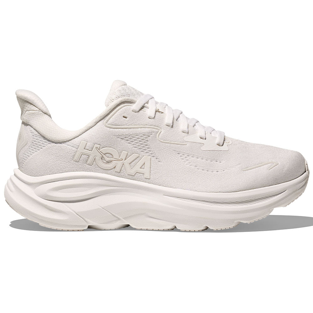 Side view on white background of Womens Hoka Clifton running shoe in White/White, Medium (Regular) width