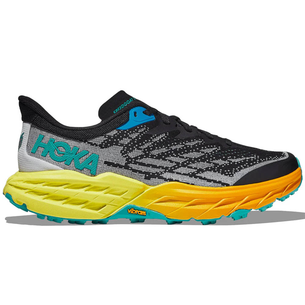 Side view on white background of Womens Hoka Speedgoat running shoe in Black/Evening Primrose, Medium (Regular) width
