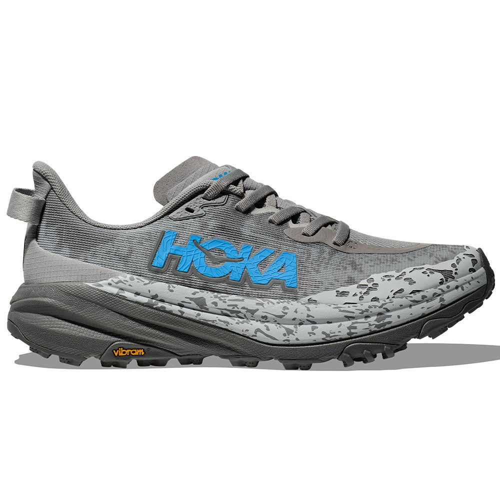 Side view on white background of Womens Hoka Speedgoat running shoe in Stellar Grey/Asteroid, Wide width