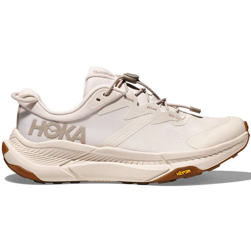 Side view on white background of Womens Hoka Transport running shoe in Eggnog/Eggnog, Medium (Regular) width