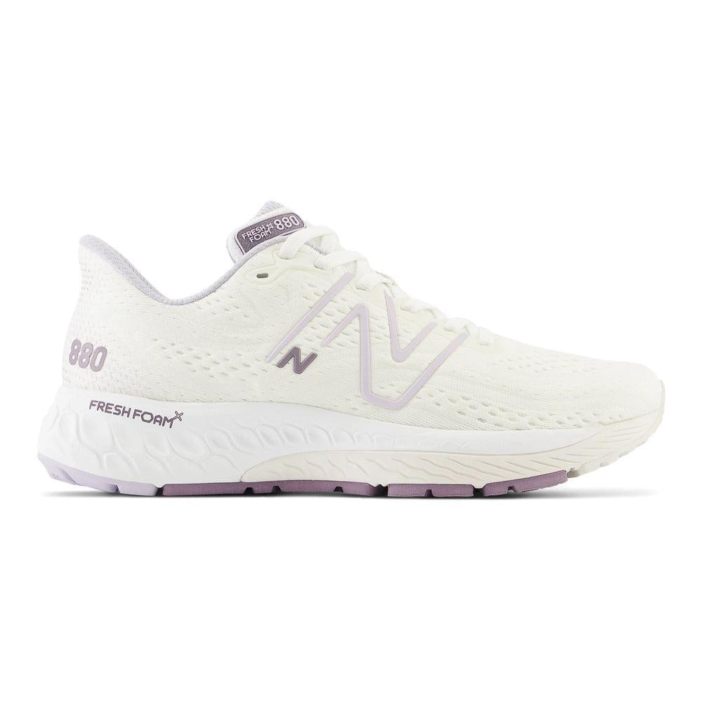 Side view on white background of Womens New Balance Fresh Foam 880 running shoe in Sea Salt/Grey Violet, Medium (Regular) width