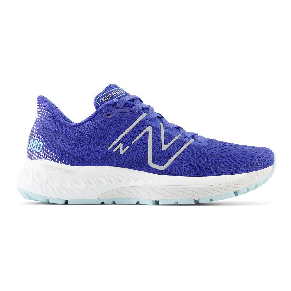 Side view on white background of Womens New Balance Fresh Foam 880 running shoe in Marine Blue/Bright Cyan, Medium (Regular) width