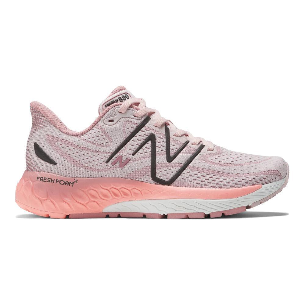 Side view on white background of Womens New Balance Fresh Foam 880 running shoe in Stone Pink/Hazy Rose, Medium (Regular) width