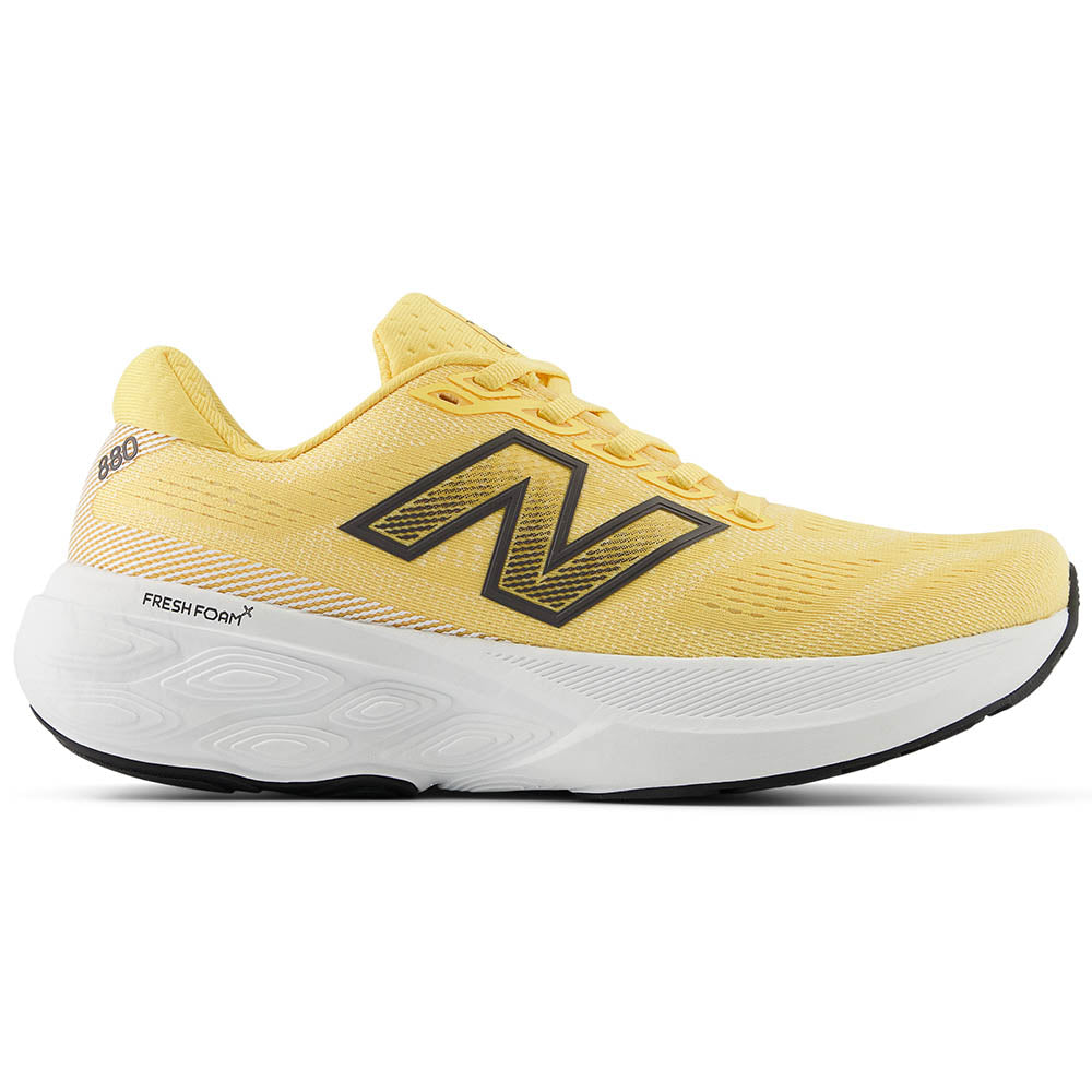 Side view on white background of Womens New Balance Fresh Foam 880 running shoe in Clementine/Calcium/Black, Medium (Regular) width