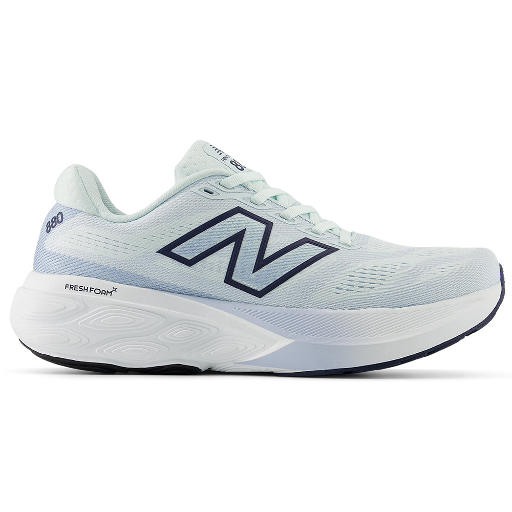 Side view on white background of Womens New Balance Fresh Foam 880 running shoe in Glint Blue/NB Navy, Medium (Regular) width