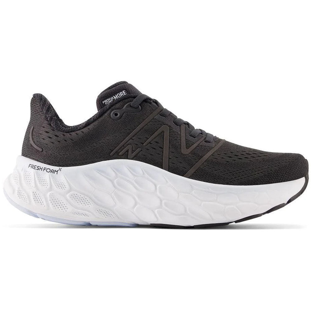 Side view on white background of Womens New Balance Fresh Foam More running shoe in Black, Medium (Regular) width