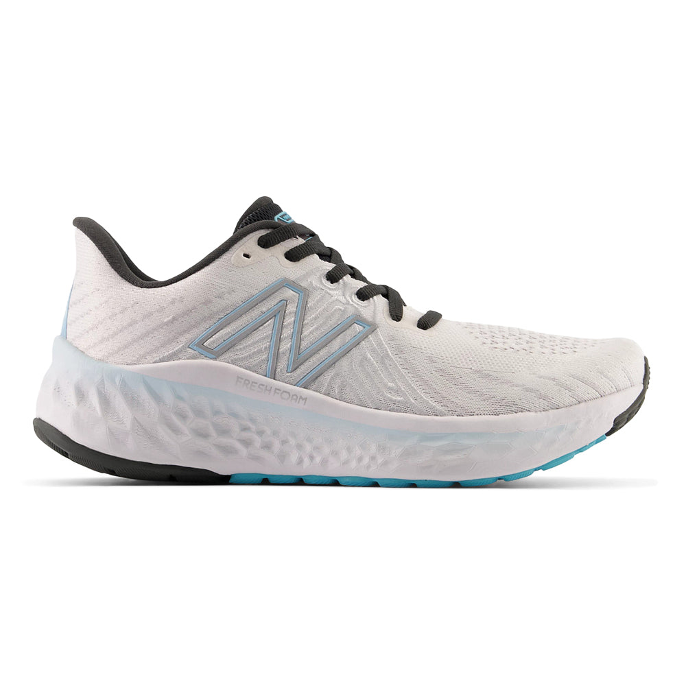 Side view on white background of Womens New Balance Fresh Foam Vongo running shoe in White/Beach Blue, Medium (Regular) width