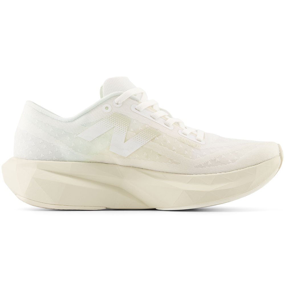 Side view on white background of Womens New Balance FuelCell Rebel running shoe in White/Linen/Sea Salt, Wide width