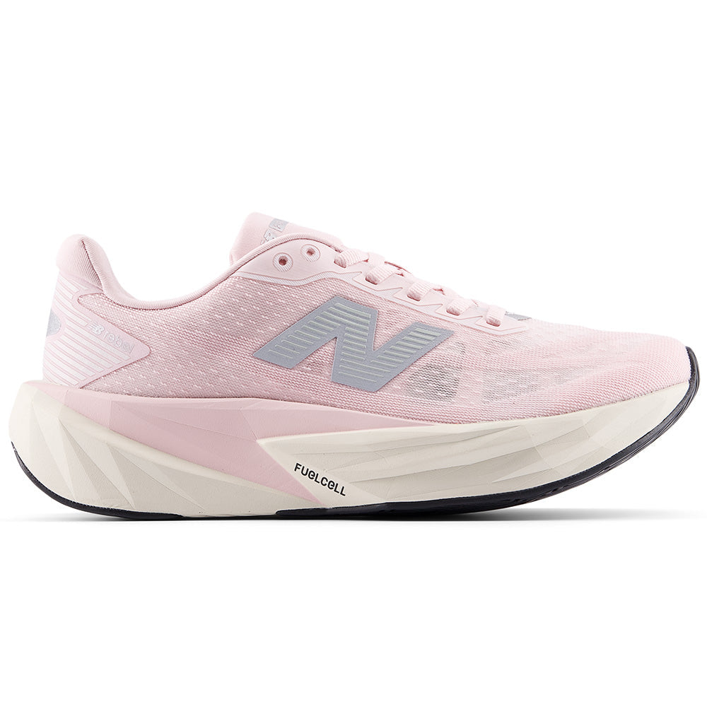 Side view on white background of Womens New Balance FuelCell Rebel running shoe in Pink Granite/Silver Metallic/Linen, Wide width