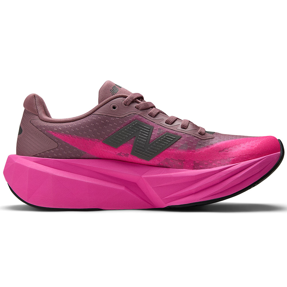 Side view on white background of Womens New Balance FuelCell Rebel running shoe in Pink Heat/Rosewood, Medium (Regular) width