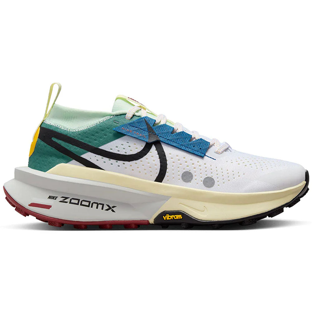 Side view on white background of Womens Nike ZoomX Zegama running shoe in White/Black/Bicoastal/Court Blue, Medium (Regular) width