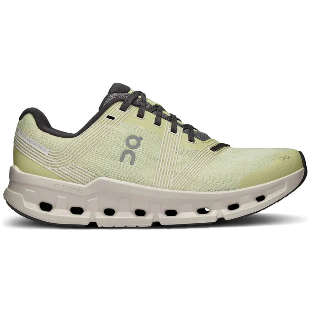 Side view on white background of Womens On Cloudgo running shoe in Hay/Sand, Medium (Regular) width