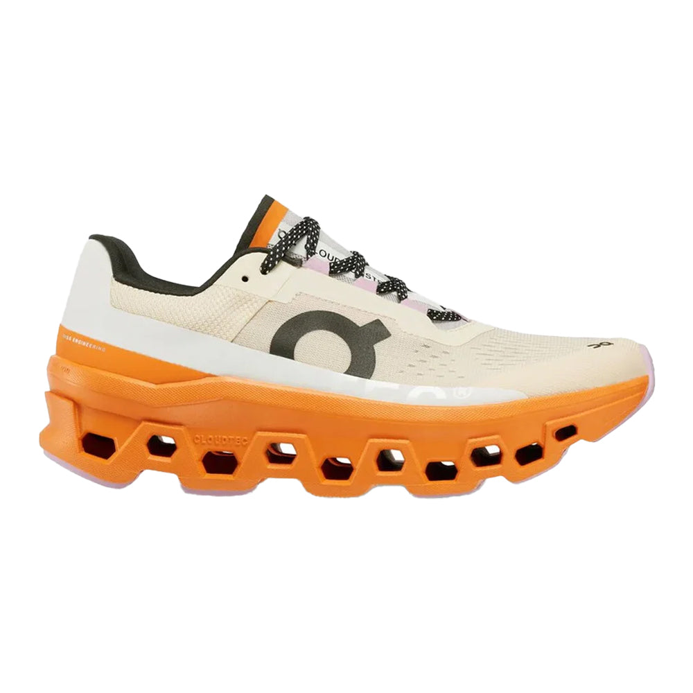 Side view on white background of Womens On Cloudmonster running shoe in Fawn/Turmeric, Medium (Regular) width