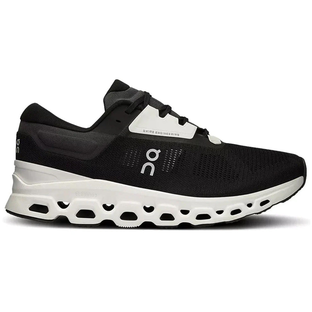 Side view on white background of Womens On Cloudstratus running shoe in Black/Frost, Medium (Regular) width