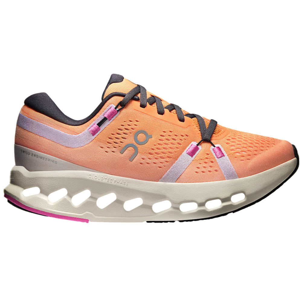 Side view on white background of Womens On Cloudsurfer running shoe in Tangerine/Ivory, Medium (Regular) width