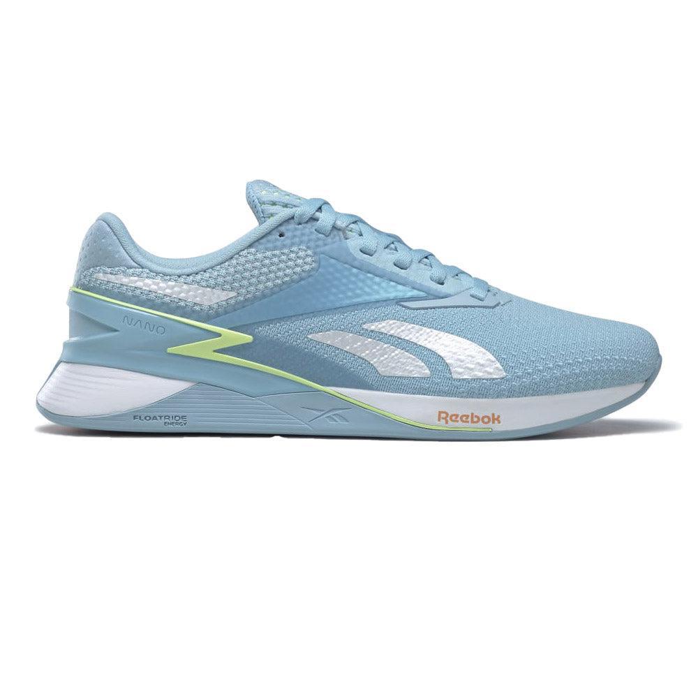 Side view on white background of Womens Reebok Nano running shoe in Blupea/Eneglw/Peafuz, Medium (Regular) width