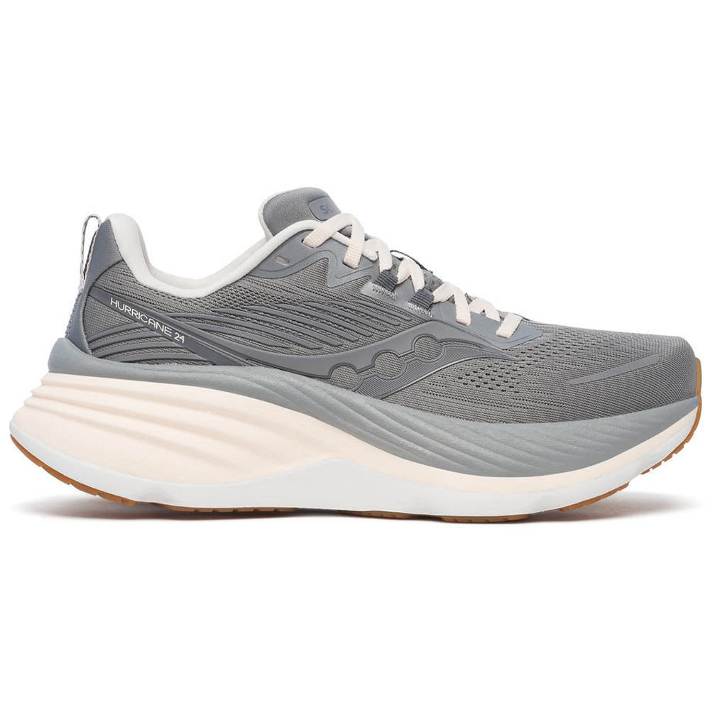 Side view on white background of Womens Saucony Hurricane running shoe in Cinder/Gum, Medium (Regular) width