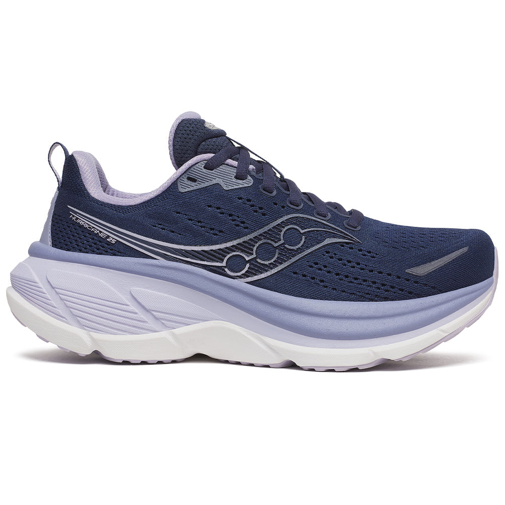 Side view on white background of Womens Saucony Hurricane running shoe in Navy/Aster, Medium (Regular) width
