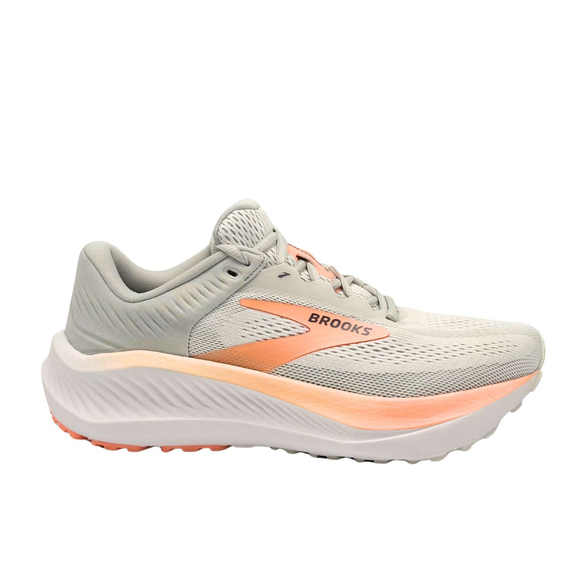 Side view on white background of Womens Brooks Anthem 8 running shoe in White/Antarctica/Peach, Medium (Regular) width