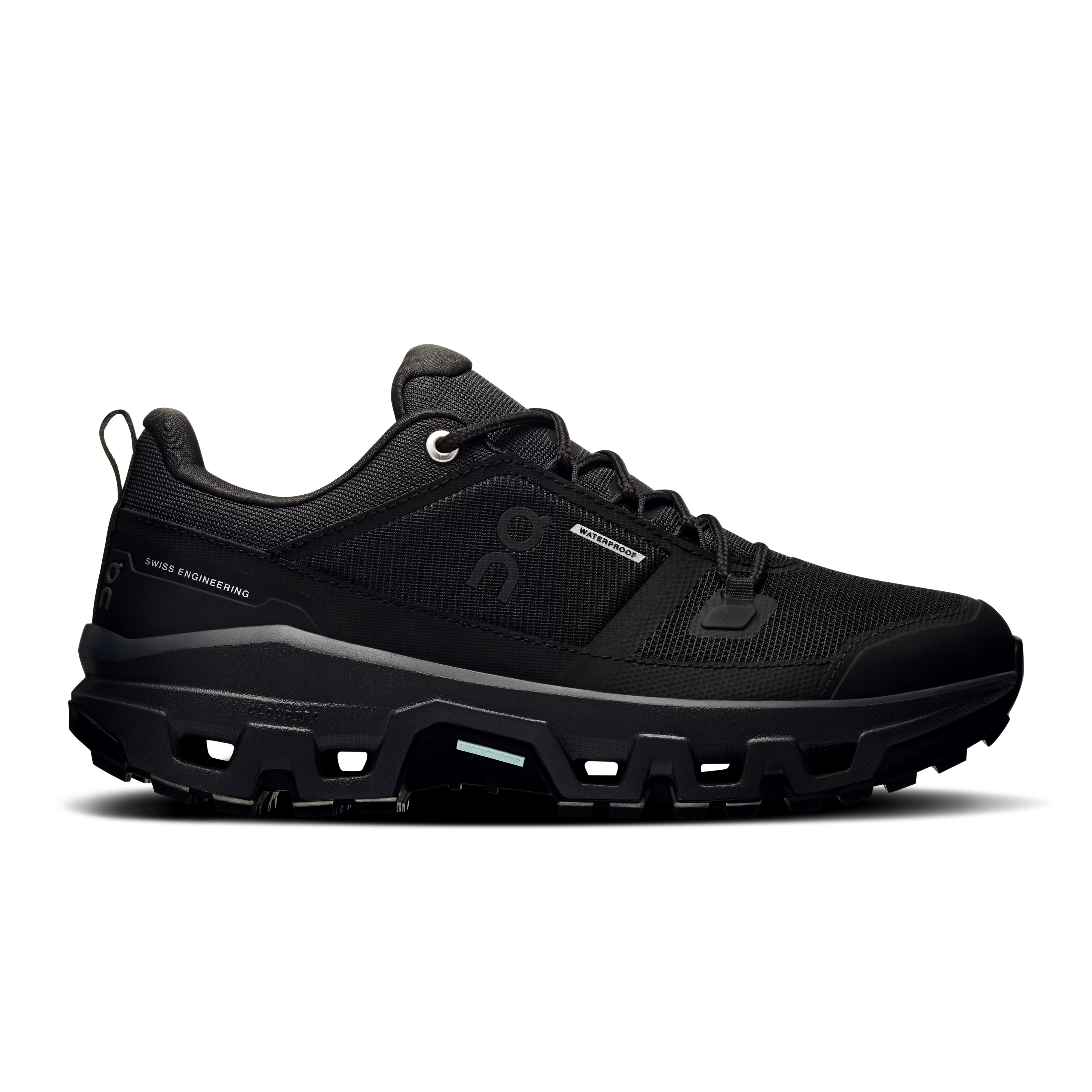 Side view on white background of Womens On Cloudrock Low WP running shoe in Black/Black, Medium (Regular) width