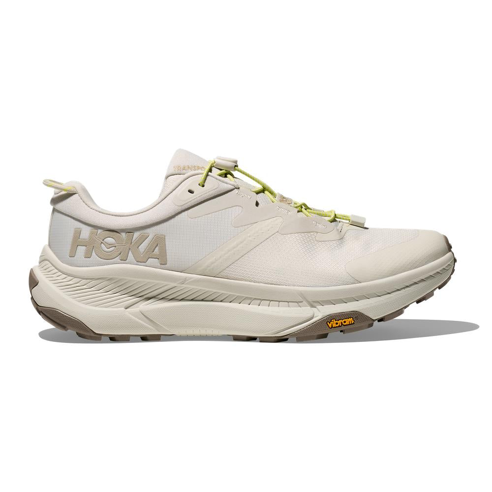 Side view on white background of Mens Hoka Transport running shoe in Truffle Salt, Medium (Regular) width