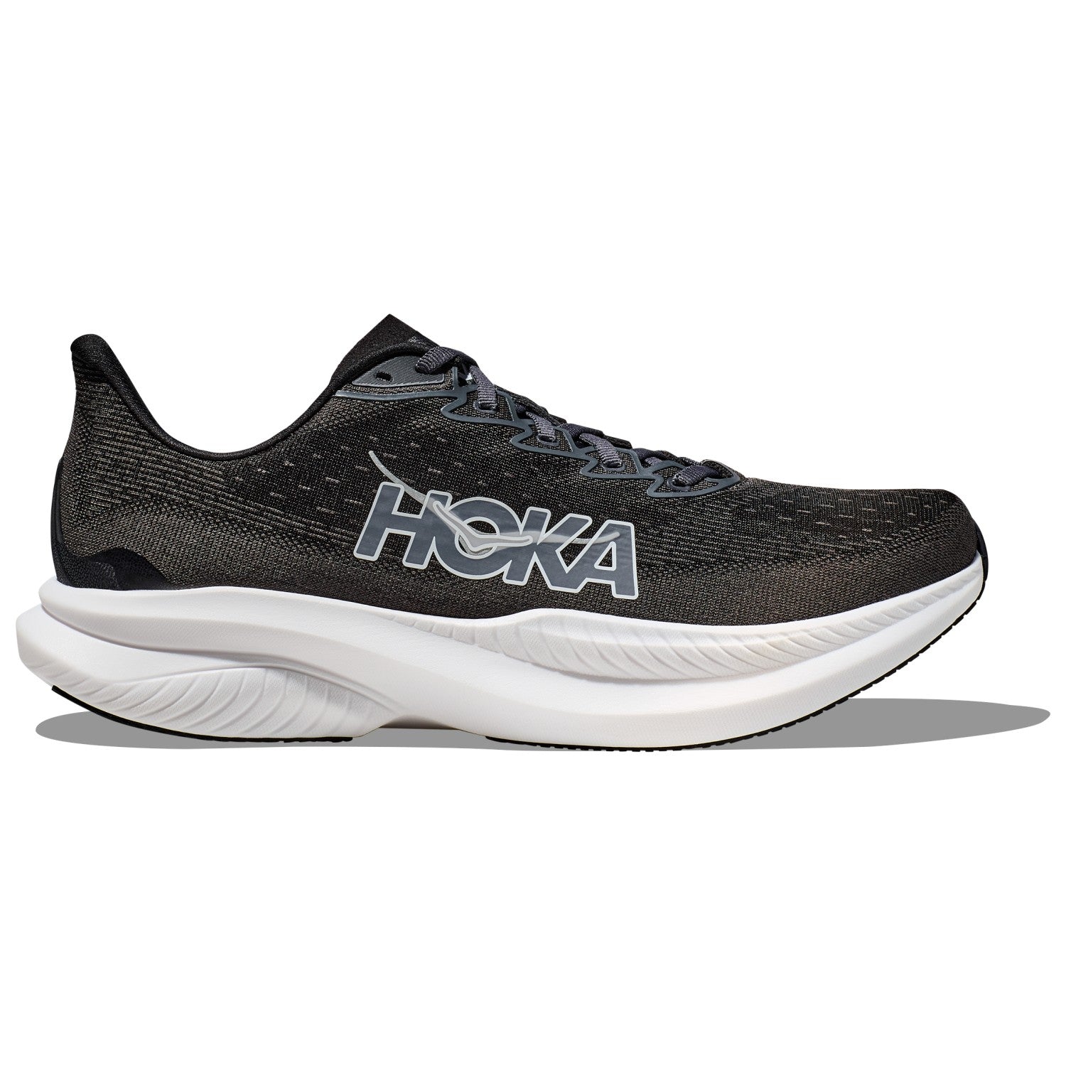 Side view on white background of Youth Hoka Mach 6 running shoe in Black/White, Medium (Regular) width