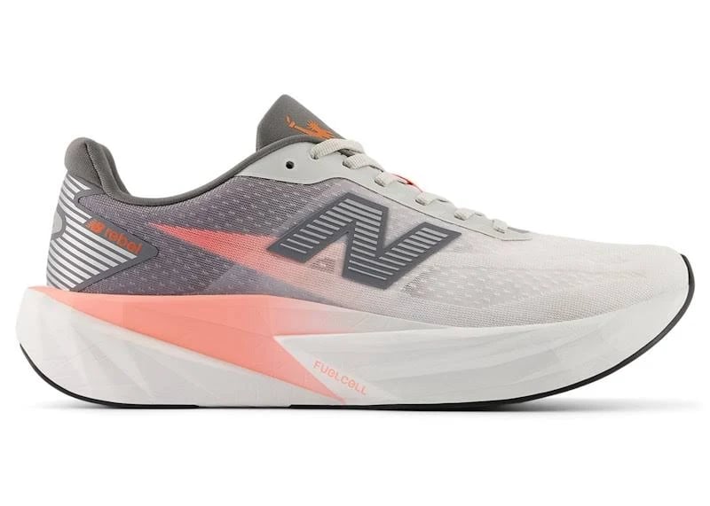 Side view on white background of Mens New Balance FuelCell Rebel v5 running shoe in Grapefruit/Greymatter/Poppy, Medium (Regular) width