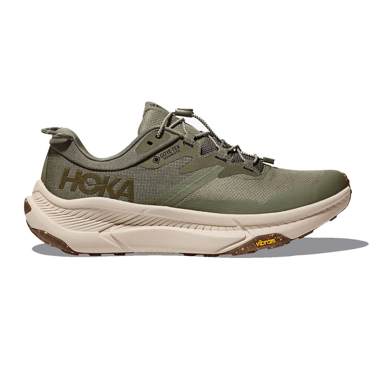 Side view on white background of Mens Hoka Transport GTX running shoe in Slate/Oat Milk, Medium (Regular) width
